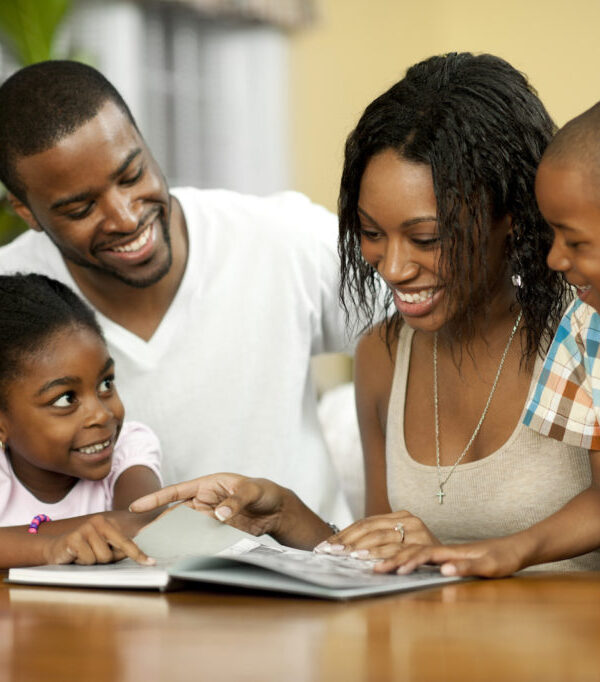 African American family reading a book